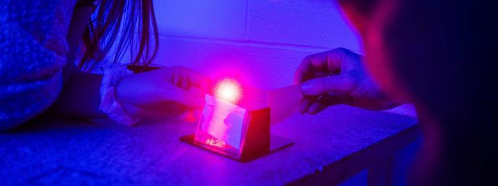 Physics Hologram Lab with students observing the demonstration.