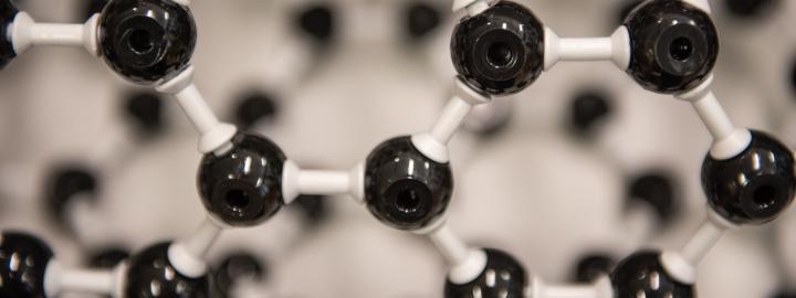 Close up photo of a chemistry framework of atoms connected together.